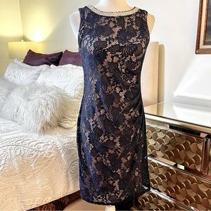 Scarlett navy blue lace form fitting dress. Size 6. Neckline rhinestone adorned.